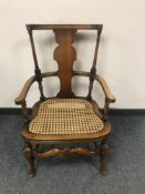 An early twentieth century beech framed armchair, width 53 cm.