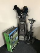 A McGregor golf bag containing assorted irons and drivers, folding golf trolley,