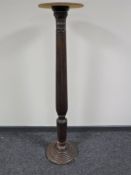 A mahogany torchere