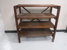A set of pine four tier open shelves
