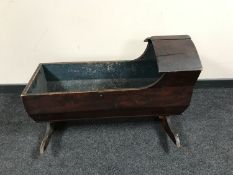 A Victorian pine rocking crib