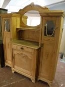 A continental oak and pine sunk centre mirror back sideboard with sentry door cabinets either side