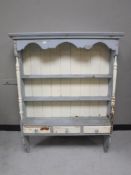 A painted pine kitchen wall rack