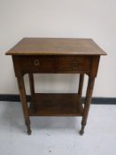 A 20th century pine two tier side table