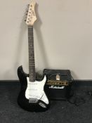 A Marshall MG 100 guitar amplifier and a CB Sky electric guitar