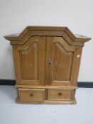 A 19th century pine double door wall cabinet