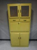 A mid twentieth century Neatette painted kitchen cabinet