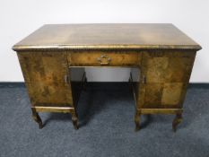 A mid 20th century beech writing desk