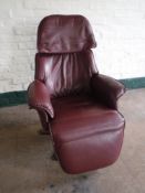 A Burgundy leather adjustable armchair