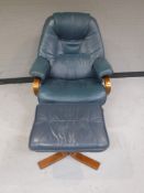 A blue leather swivel relaxer chair with stool retailed by Chapmans