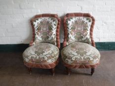 A pair of early twentieth century nursing chairs,