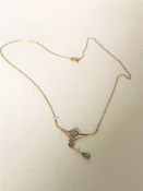 An aquamarine and seed pearl pendant on chain,