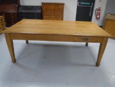 An Edwardian oak library table fitted two drawers