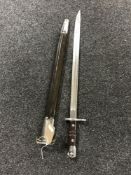 A Remington bayonet in scabbard dated 1913