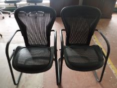 A pair of Herman Mille style office armchairs
