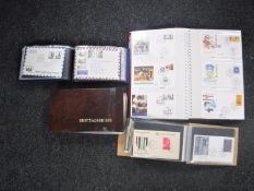 Four albums of first day covers