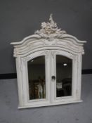 A French style double door mirrored cabinet