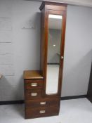 A ship's style mirrored door wardrobe fitted four drawers