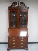 A Victorian style bureau bookcase