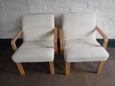 A pair of Danish beech framed Magnus Olesen armchairs