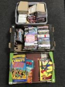 Two crates and a box of CDs and DVDs, annuals including The Broons, Topper,