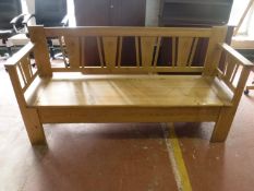 A twentieth century pine storage bench