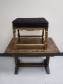 An oak extending refectory coffee table and an upholstered stool