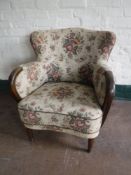 An early twentieth century floral upholstered armchair
