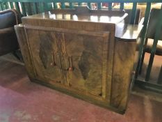 A walnut Art Deco sideboard CONDITION REPORT: One of the front door handles is
