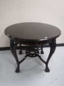 An early 20th century occasional table on claw & ball feet