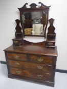 A Victorian walnut four drawer dressing chest