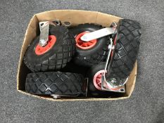 A box of assorted trolley wheels