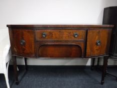 A mahogany bow-fronted Sheraton style sideboard