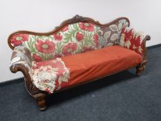 A Victorian mahogany framed scroll arm settee