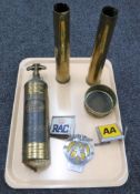 A tray containing two vintage AA badges together with an RAC badge, brass Pyrene fire extinguisher,