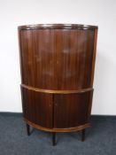 A mid twentieth century mahogany double door cabinet