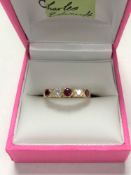 A 14ct gold synthetic ruby ring, size N/O.