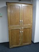 A 19th century pine four door cabinet