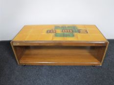 A 1970's teak two tier tile topped coffee table