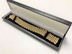 A 9ct gold flat cuff bracelet, 32.1g.