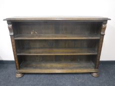 A set of early twentieth century carved oak open bookshelves