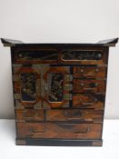 A Japanese Meiji period lacquered table cabinet