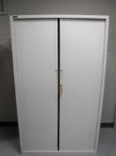 A Triumph shutter door stationary cabinet with key