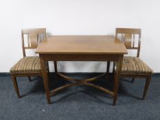 An early twentieth century inlaid mahogany dining table,