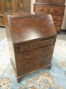 An early 20th century mahogany bureau,