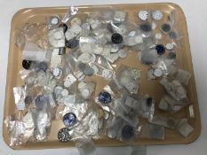A large quantity of watch dials