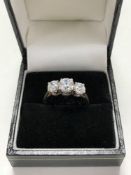 A 14ct gold three stone ring, size O.