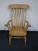 A pine farmhouse kitchen armchair