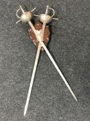 A pair of rapiers on shield wall bracket