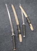 An Indian sword together with two Japanese style samurai swords and a hand axe